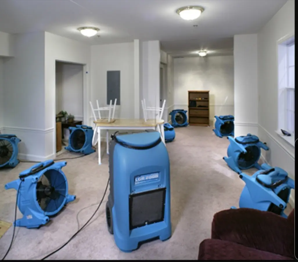 Air movers and dehumidifier setup for Water Damage Restoration in Donaldsonville